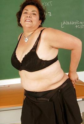 Mature teacher strips down to just her fishnet stockings