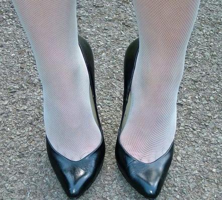 Blonde stiletto girl in pantyhose and high heels