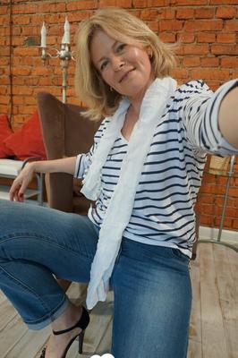 Blonde MILF loves trying out various stockings