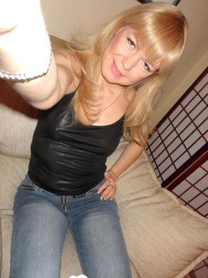 Hot MILF flashes her titty while on camera