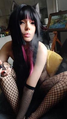 Succubus Babe smoking in fishnets - 26 Pics