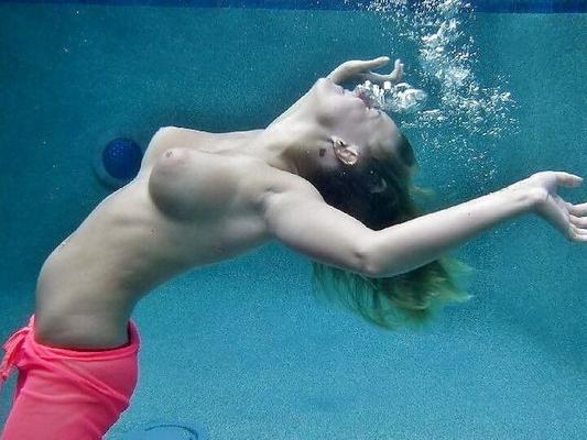 Enjoying her underwater tits