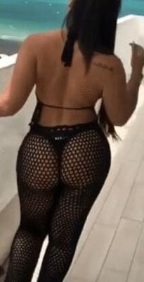 Sexy woman in black thong and mesh pants