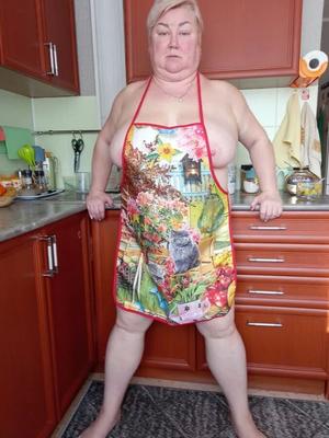 In the kitchen in an apron
