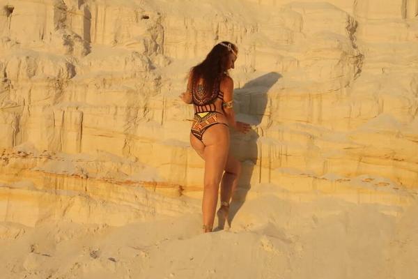 On sunset on pink sand