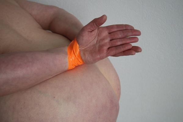 Tape tied bondage