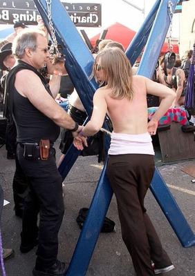 Girl getting a back flogging at Folsom Fair