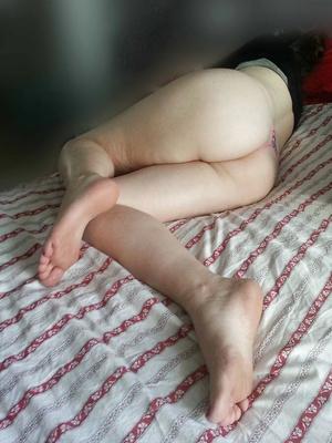 Side view of ass and feet