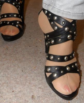 studded high heels of my wife with painted toenails