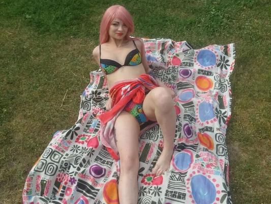 Pink-haired beauty plays with her love tunnel