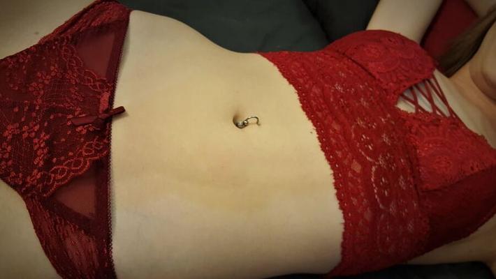 Lady in red on the bed...