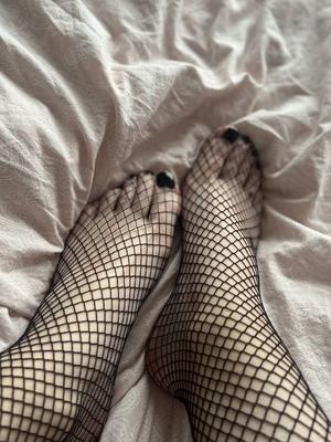 Foot with fishnet socks