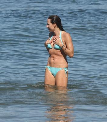 Minnie Driver wearing sky blue bikini on the beach in Malibu