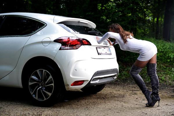 6P Bootfetish: girl in thigh high boots pushing a car 