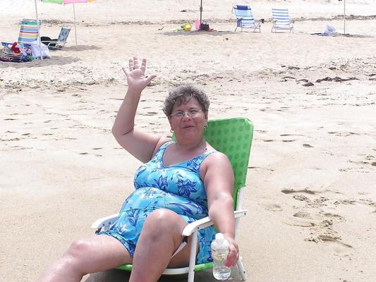 25P Old granny at beach 