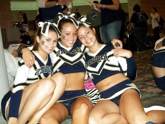 25P Cheerleader cuties with there legs wide apart. 