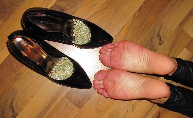 22P Foot torture with peas in high heels, leggings and corset