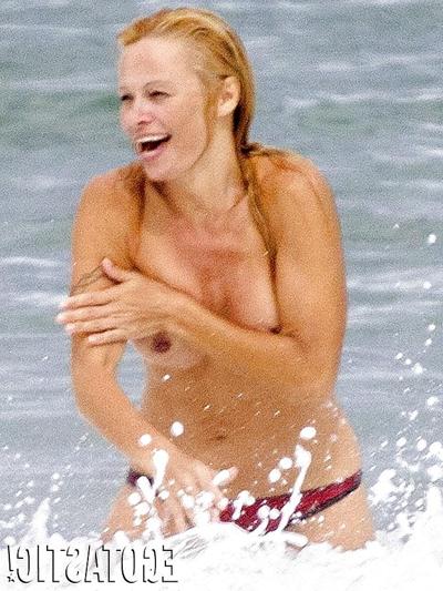 11P Pamela Anderson Goes Topless on a Beach in France