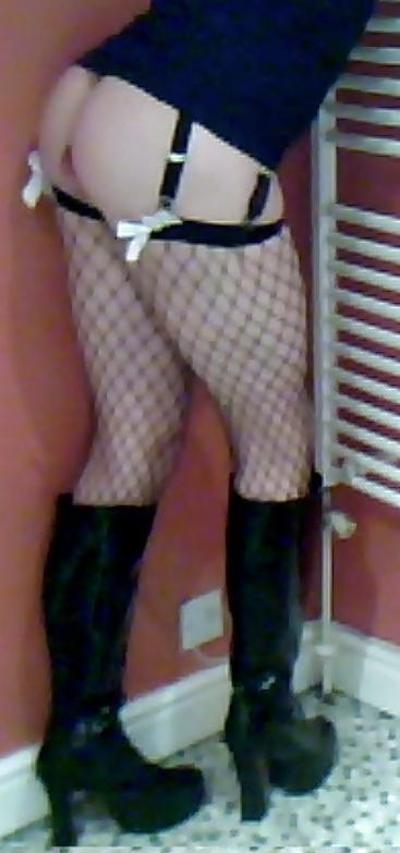 7P Fishnets, pvc boots and black short skirt
