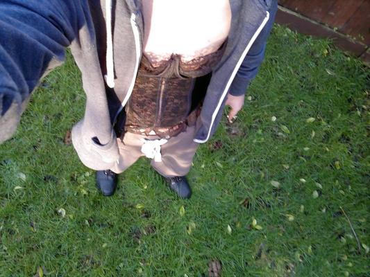 4P In the woods with a black corset on.