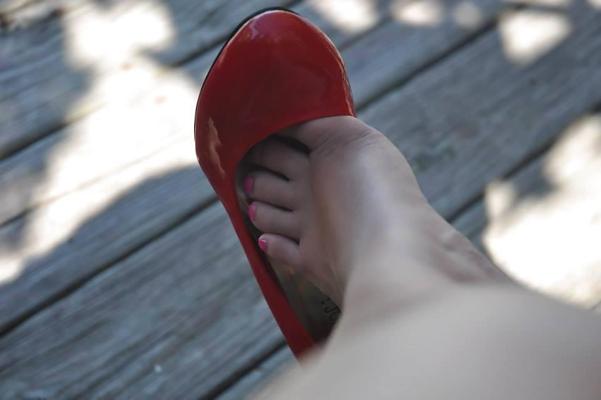 12P Caras red shoe tease and dangle.