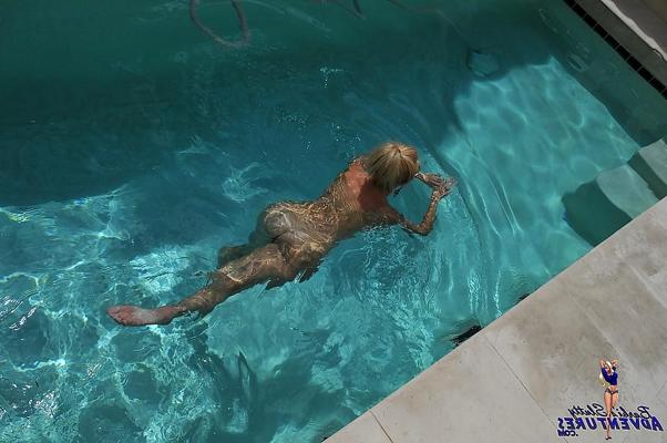15P Cute blonde MILF Barbi Sinclair shows her fantastic body wearing sexy bikini in the pool.