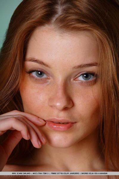18P Sensual brunette babe Indiana A strips to reveal her shaved pussy