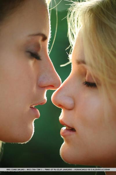 18P Hot lesbians Mari E & Orvelia O showing tiny tits while kissing in the woods