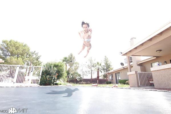 12P Leggy solo girl Lola Hunter poses outdoors beside swimming pool in bikini
