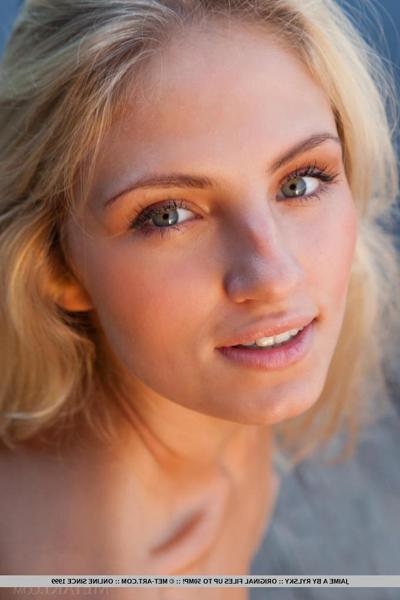 18P Young blonde female Jaime A stripping off clothes to model naked outdoors