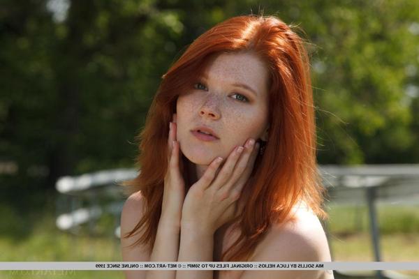 18P Natural redhead Mia Sollis outdoors in bare feet airing nude tits and pussy