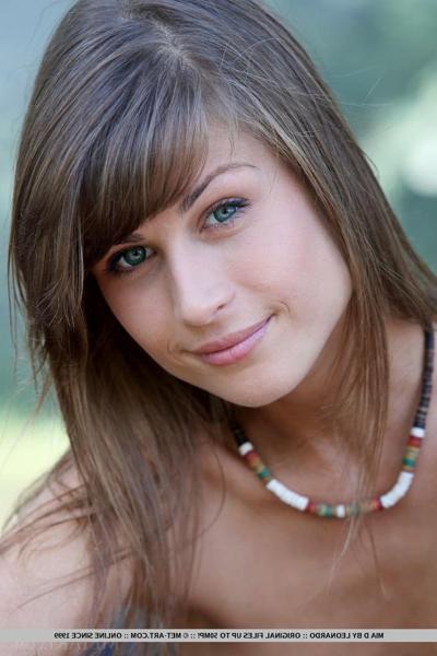 18P Petite teen babe Mia D exhibiting tiny tits and bald slit outdoors in woods