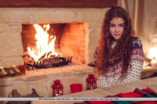 18P Brunette teen Adel C curls up by the fireplace for the holidays