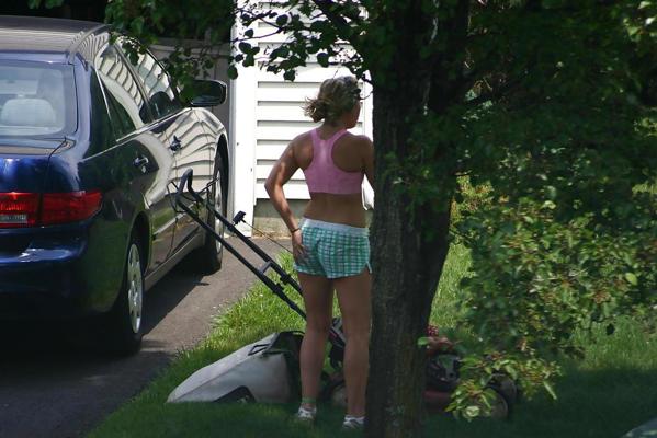7P Neighbor mowing her lawn