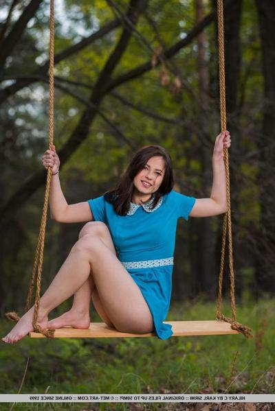 18P Brunette coed Hilary C gets naked on a swing in "Porrea"