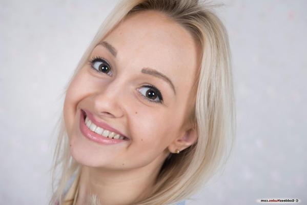 16P Iralin poses in front of the camera, showing her innocent face, and youthful body