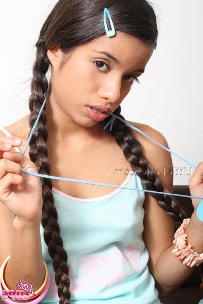 12P Hot latina girl Lupe offers herself up in pigtails and panties