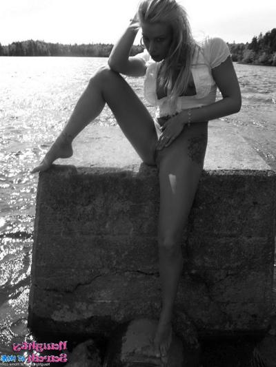 15P Pictures of Naughty Sarah on the beach in black and white