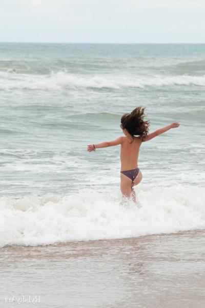 16P Pictures of hot teen girl Nedda enjoying her nakedness on a beach