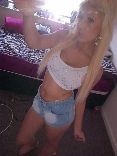10P Chick flaunts her big round tits while posing in tight tops