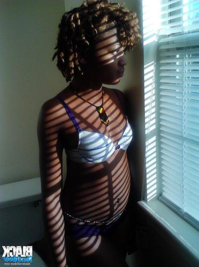 8P Black teen with small tits posing in the sun lights