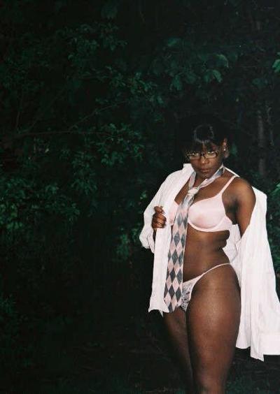12P Black chick with short hair poses like a model