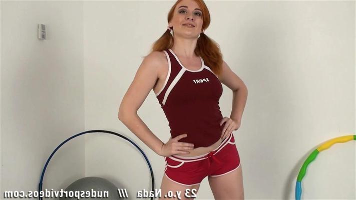 15P Fit redhead undresses for nude exercising