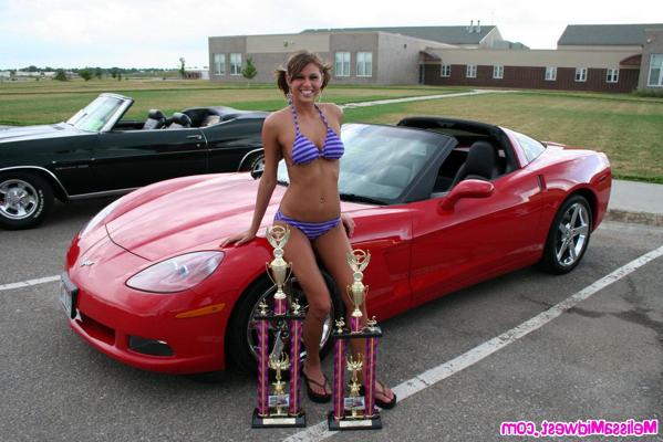 15P Melissa Midwest posing on cars at a car show