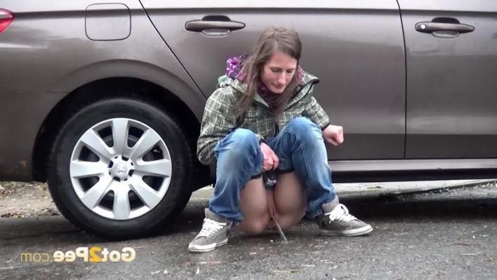 15P Two friends piss behind a parked car