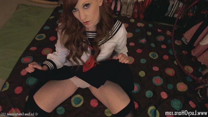 15P Busty redhead Lucy teases