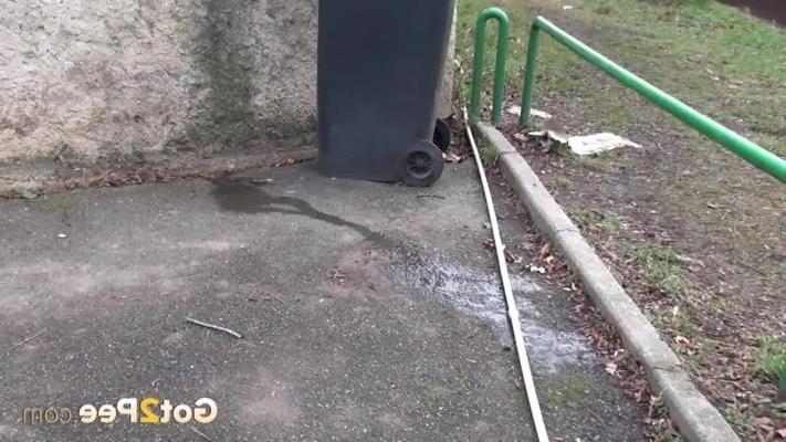 15P A pretty blonde pulls down her trousers to pee
