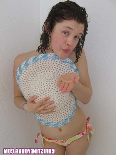 15P Cute young hottie Christine Young teasing on a nice beach