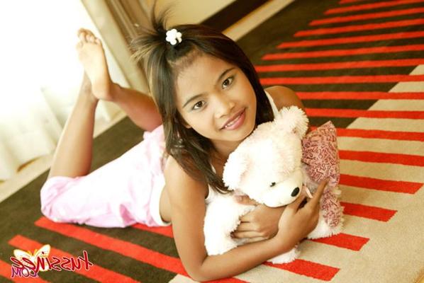 15P Thai Teen Tussinee plays with a teddy bear in bed