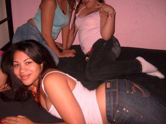 15P Pics of a cute Latina teen including her getting topless in bed and sucking some